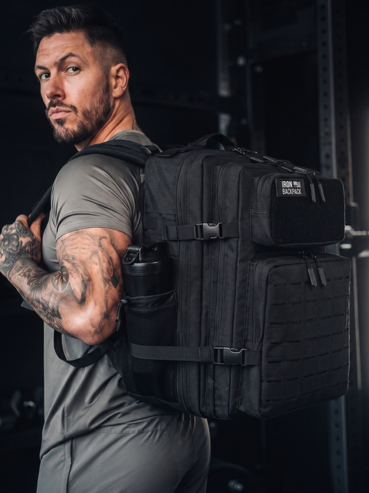 Athlete carrying a loaded pack — whole-body strength, the thing grip strength is really measuring